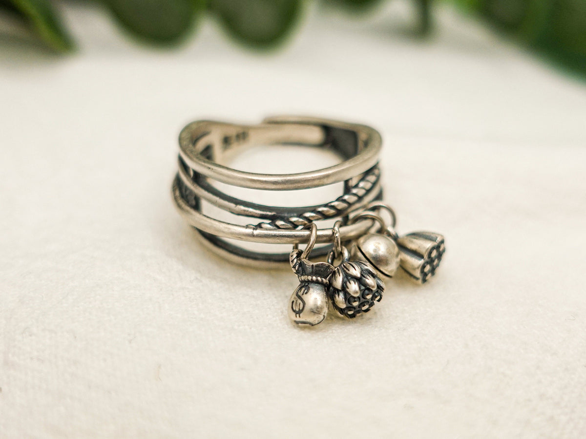Sterling Silver Lotus Tassel Ring: Adjustable Crossover Band