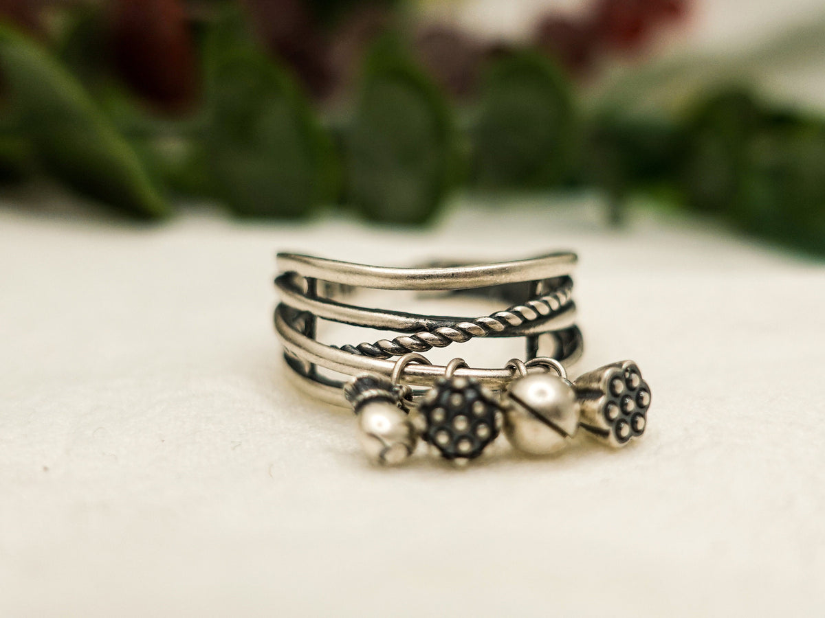 Sterling Silver Lotus Tassel Ring: Adjustable Crossover Band