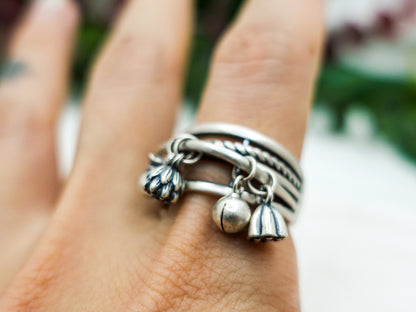 Sterling Silver Lotus Tassel Ring: Adjustable Crossover Band